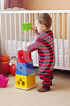 Baby age of 1 year plays nesting blocks