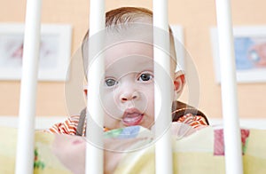 Baby age of 4 months in white bed