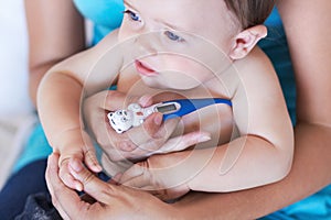 Baby, armpit and thermometer to measure of fever for sick with parent while holding hand in trust. Mother, infant and