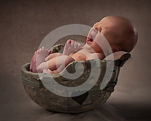 Baby in an Army Helmet Yawning