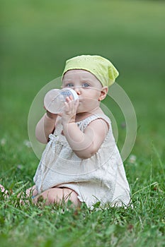 Baby with baby bottle photo