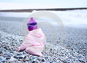 Baby from the back on the beach