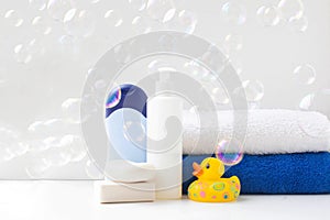 Baby bath products, baby care, Yellow rubber duck for bath games. Soap bubbles, bath foam, soap bubbles