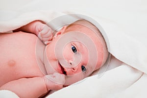 Baby after bath in towel.