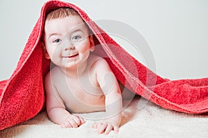 Baby After Bath Under Red Towel on Tummy