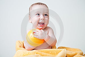 Baby After Bath Wrapped in Yellow Towel Sitting