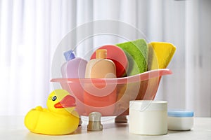Baby bathing accessories, cosmetic products and toy