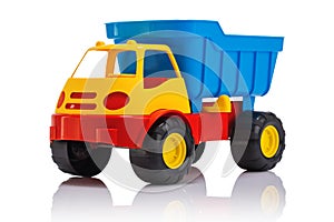 Baby beach toys. Plastic car or truck isolated on white background