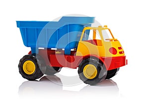 Baby beach toys. Plastic car or truck isolated on white background