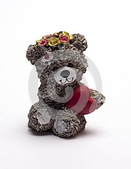 Baby bear with heart on white background