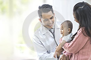 baby being checked by a doctor