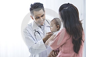 Baby being checked by a doctor