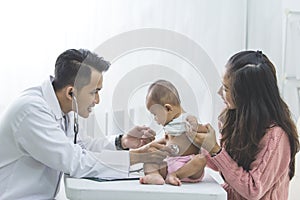 Baby being checked by a doctor