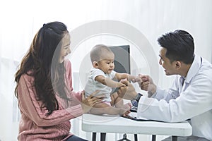 Baby being checked by a doctor