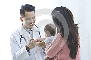Baby being checked by a doctor