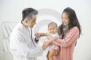 Baby being checked by a doctor