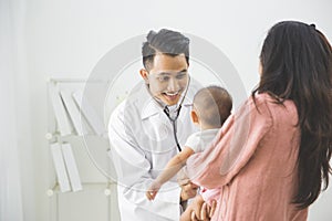 Baby being checked by a doctor