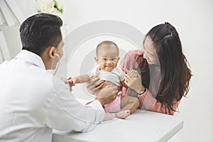 Baby being checked by a doctor