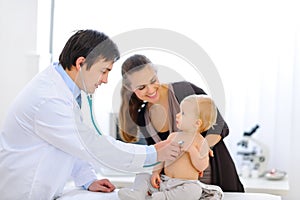 Baby being checked by doctor using stethoscope