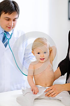 Baby being checked by doctor using stethoscope