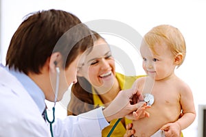 Baby being checked by doctor using a stethoscope