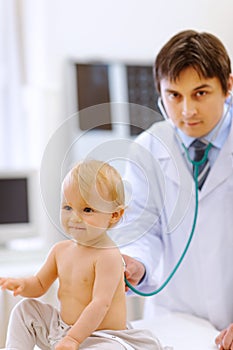 Baby being checked by a doctor using a stethoscope