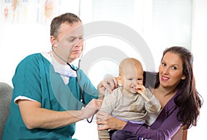 Baby being checked by a doctor using a stethoscope