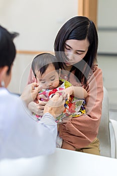 Baby being checked by a doctor using a stethoscope. Pediatrician doctor prepare for examines baby with stethoscope checking heart