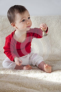 Baby with bell photo
