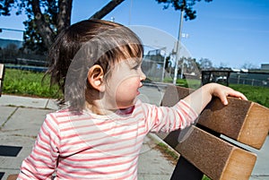 Baby on the bench in the park