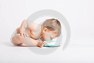 Baby Bends In to Eat Birthday Cake with Face