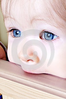 Baby Biting on Crib - Closeup