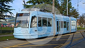 Baby blue Seattle streetcar on the First Hill Line