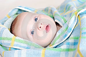 Baby in blue towel