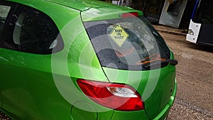 Baby on board on the rear window of the car , safety