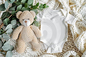 Baby bodysuit mockup with teddy bear, eucalyptus on ivory blanket infant onesie template