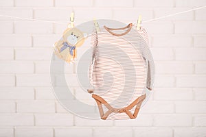 Baby bodysuit and soft toy