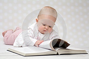 Baby with the book