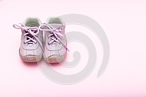 Baby booties pink on pink background