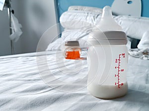 Baby bottle on the bed in hospital