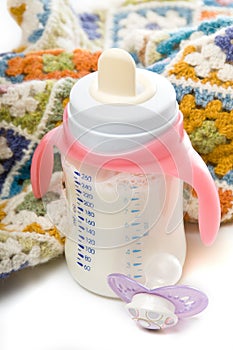 Baby bottle, pacifier and blanket