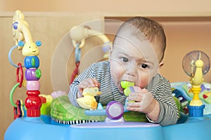 Baby in bouncer photo