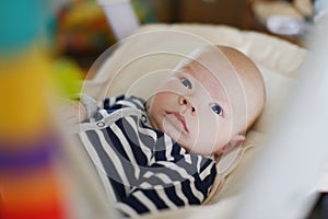 Baby in bouncer chair