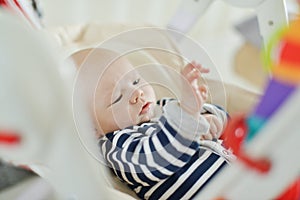 Baby in bouncer chair