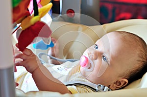 Baby in bouncer chair