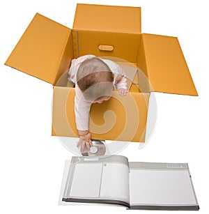 Baby in a box with instruction manual and disk