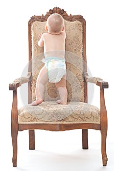 Baby boy on an antique chair