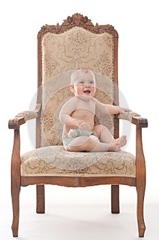 Baby boy on an antique chair