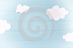 Baby boy background, white clouds on the blue wooden background
