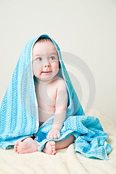Baby Boy After Bath Wrapped in Blue Towel Sitting